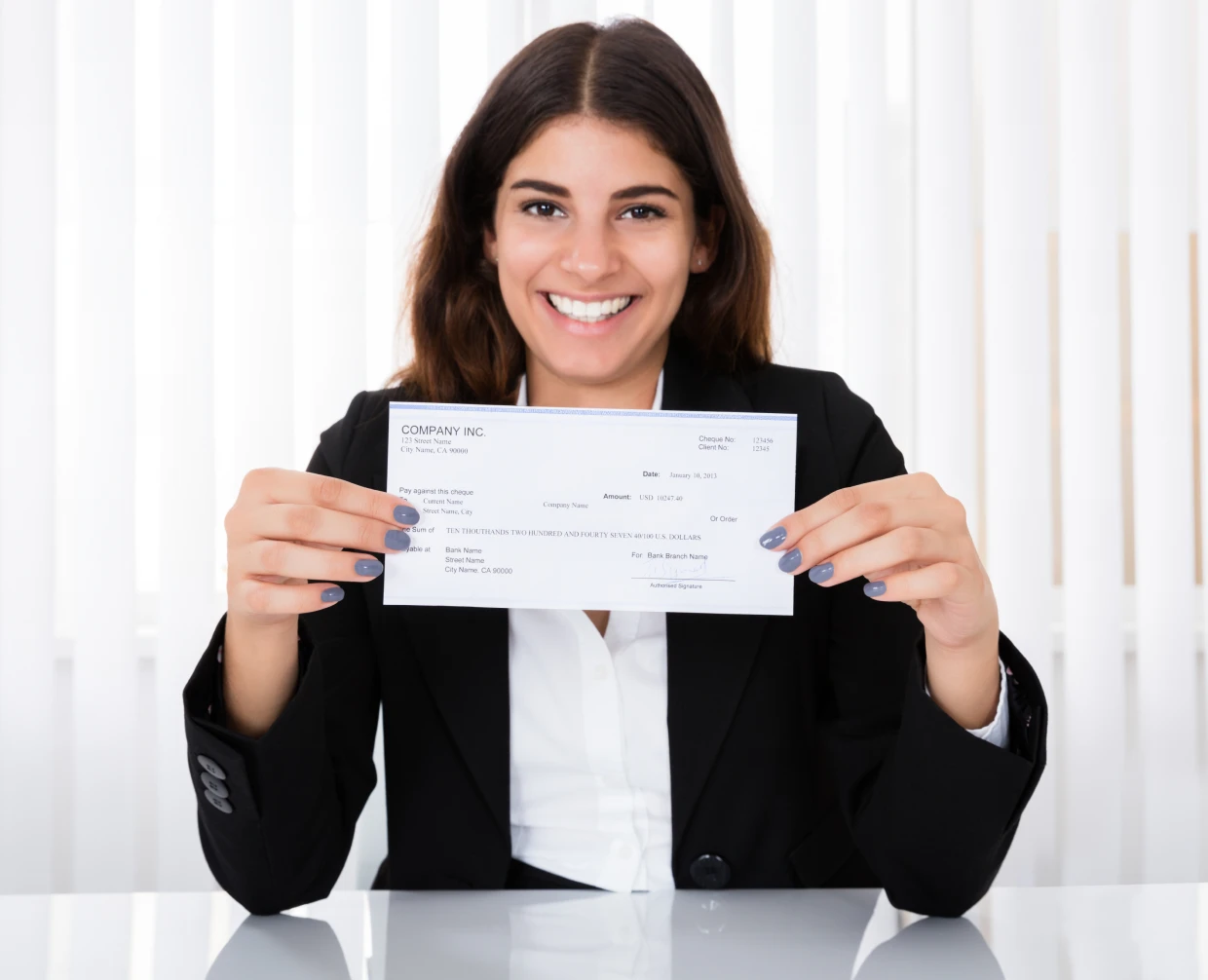 Happy employee with a payment check